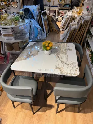 Dining Set With Gray Colored Seats and Marble Table