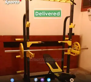 Squat Rack and Adjustable Bench With Barbell