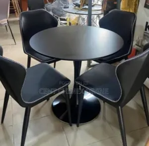 Black Leather Chair With Round Wood Top Table
