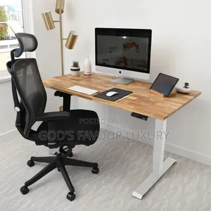 Motorised Adjustable Height Computer Desk and Ergonomic Mesh Chair.