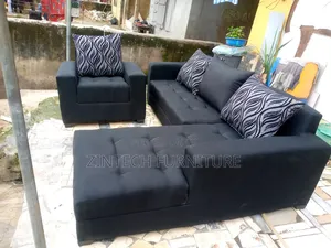 L Shaped Black Color Sofas and a Single Seater