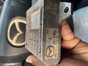 Transmission Control Module (Tcm) the Part Number Is L5e4-18-9e1a