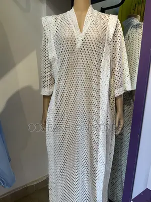 Female White Gowns Made With Starchy Lace Material.