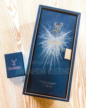 Glenfiddich Grand Cru 23 and a Glenfiddich Bronze Lighter