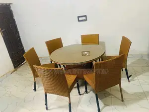 Durable Rattan Set of Round Table and 6 Armless Chairs.