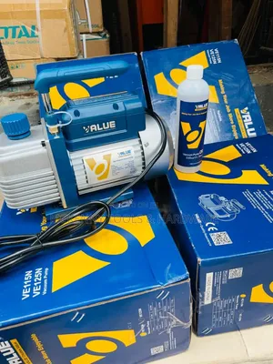 Value Ve115n Vacuum Pump, Along With a Bottle of Vacuum Pump Oil,