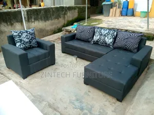 Gray L Shape Sofas and a Single Seater With Pillows