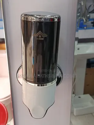 Wall Mounted Liquid/Soap Dispenser.