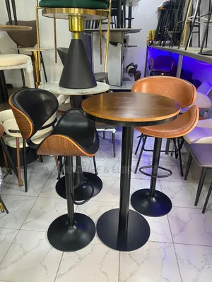 A Set of Bar Table With Two High Bar Stools