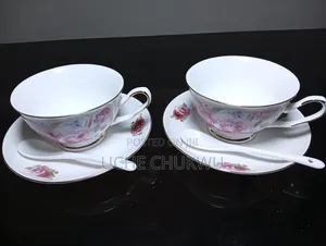 A Pair Of Tea Cups With Saucer