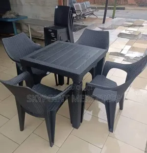 A Set of Luggano Table and Chairs