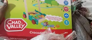 U.K Chad Valley Crocodile Trolley at Discounted Price.
