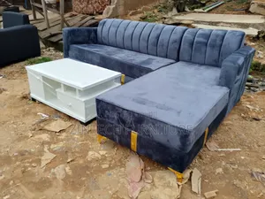 Gray Color L Shaped Sofas and a Table