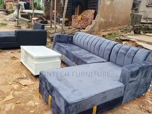 Gray Color L Shaped Sofas and a Table