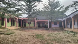 An Uncompleted Deckened Structure of 12 Rooms and 4 Toilets.