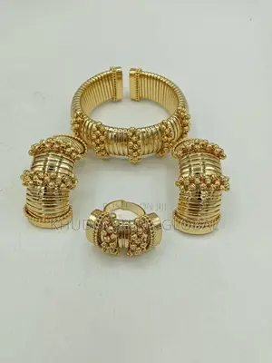 Set Of Costume Jewelry, Cuff Bracelet, A Ring, And Two Ear Cuffs