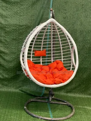 White Rattan Outdoor Swing and Red Pillow