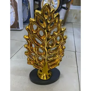 This Is a Gold-Colored Leaf-Shaped Figurine or Tree Decor
