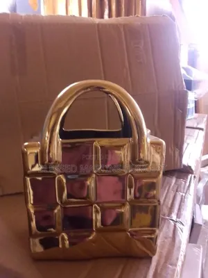 This Is a Gold Ceramic Handbag-Shaped Vase or Decorative Ornamen