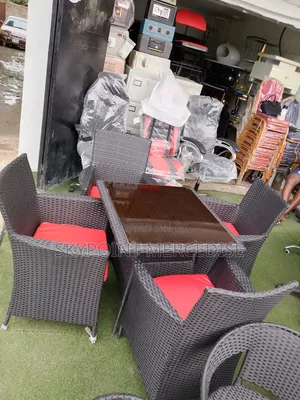 A Set of Ratian Table and Chairs