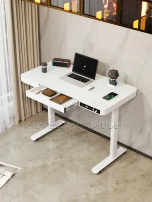 Electric Height-Adjustable Standing Desk With a Storage Drawer.
