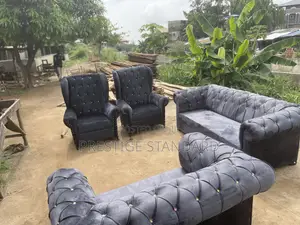 A Standard Sofa With Royal Chairs