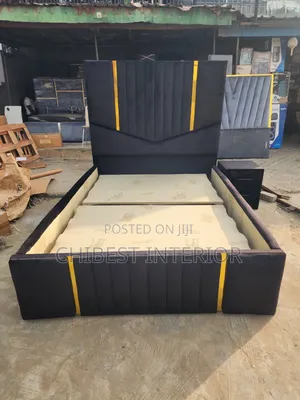 A Padded Four and Half by Six Bed With Side Drawer.