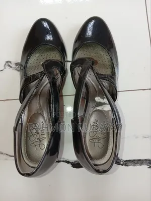 Black Heel Shoe and Blue Sandal