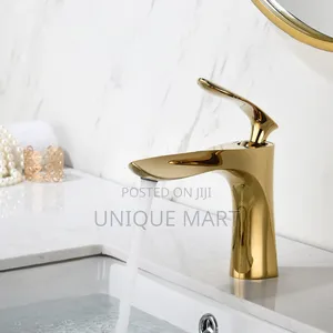 Gold-Plated Single-Handle Mixer Tap for Wash Hand Basins.