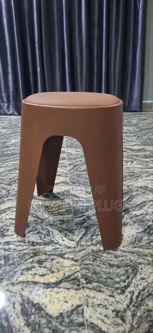 These Are Modern, Stackable Plastic Stools With Cushioned Seats.