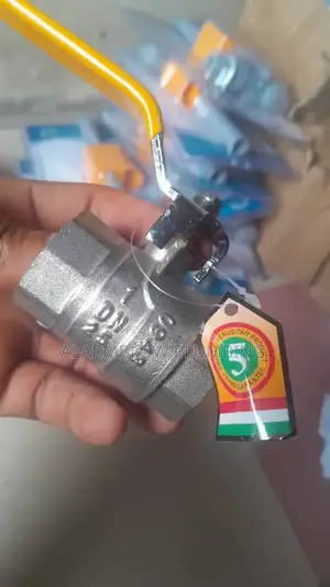 1" Brass Ball Valve Threaded With a Yellow Lever Handle.