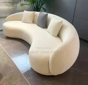 Curved Cream Coloured Sofa