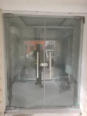 Modern Frameless Glass Shop Door – Clean Classy Silver Design