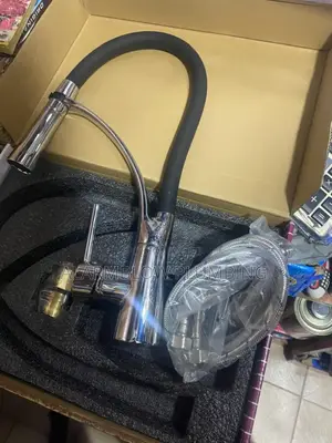 Single-Handle Kitchen Sink Mixer Faucet With a Pull-Down Sprayer.