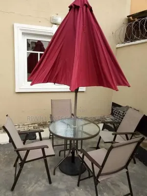 Umbrella, Table and Four Chairs