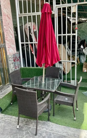 Four Chairs, Table and Umbrella