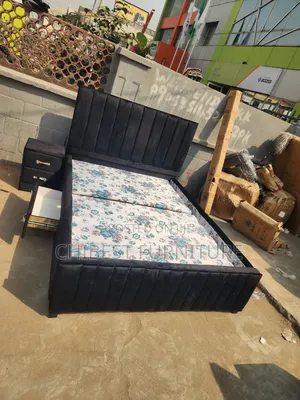 Queen Size Bed Stand With Its Side Drawers.