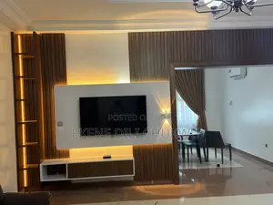 “Luxury Tv Wall Unit With Egger Wood Finish and Wooden Strip Design”
