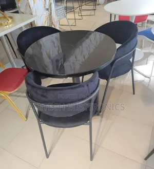 Round Black Glass Dining Table With 3 Dark Velvet Chairs.