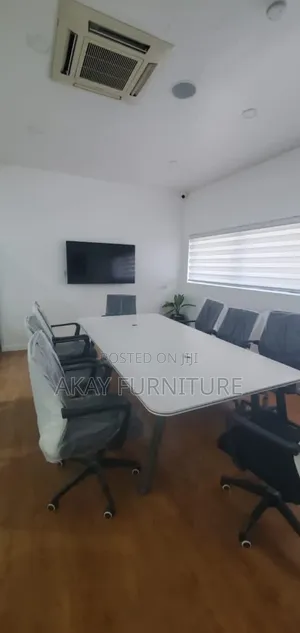 White Conference Table Sits 8 People
