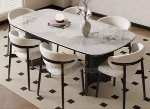 Boise Harabai Sintered Stone Dining Table With Modern Dining Chairs.