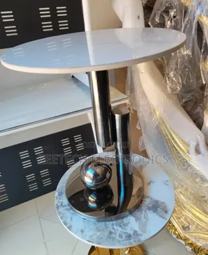 Round Side Table With a White Marble Top and a Polished Stainless Stee
