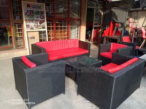 Outdoor Rattan Wicker Furniture Set With Red Cushions.