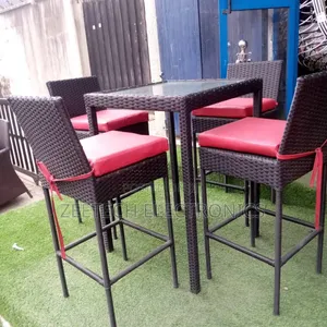 Outdoor 5-Piece Steel Wicker Patio Bar Set With Red Cushions.