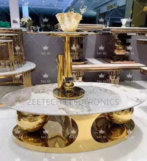 Modern Oval Marble Top Center Table With a Gold Metal Base.