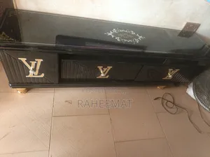 Black Tv Stand With Golden Design, With Lewis Hamilton