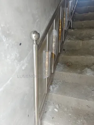A Round Stainless Steel Handrail Represents the Classic Handrail.