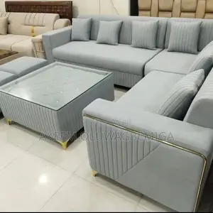 L Shaped Chair With Two Poufs and Center Table