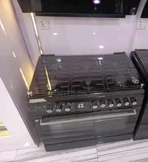 Black Standing Gas Cooker Featuring a Glass Cooktop and Oven.