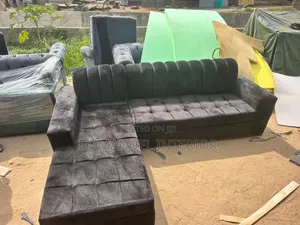 A Standard Black Velvet Seater Couch
